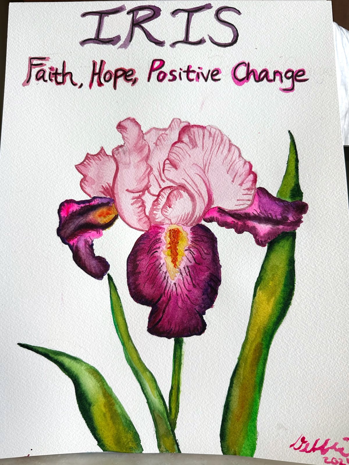 Watercolor of a magenta iris, titled in her handwriting: Iris. Faith, Hope, Positive Change.